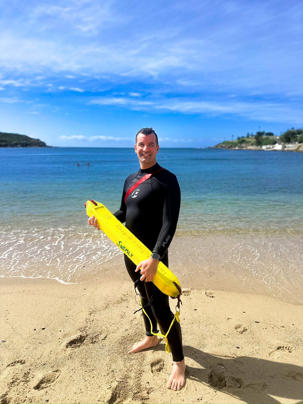 Jason Cram on a Sydney beach in a wetsuit